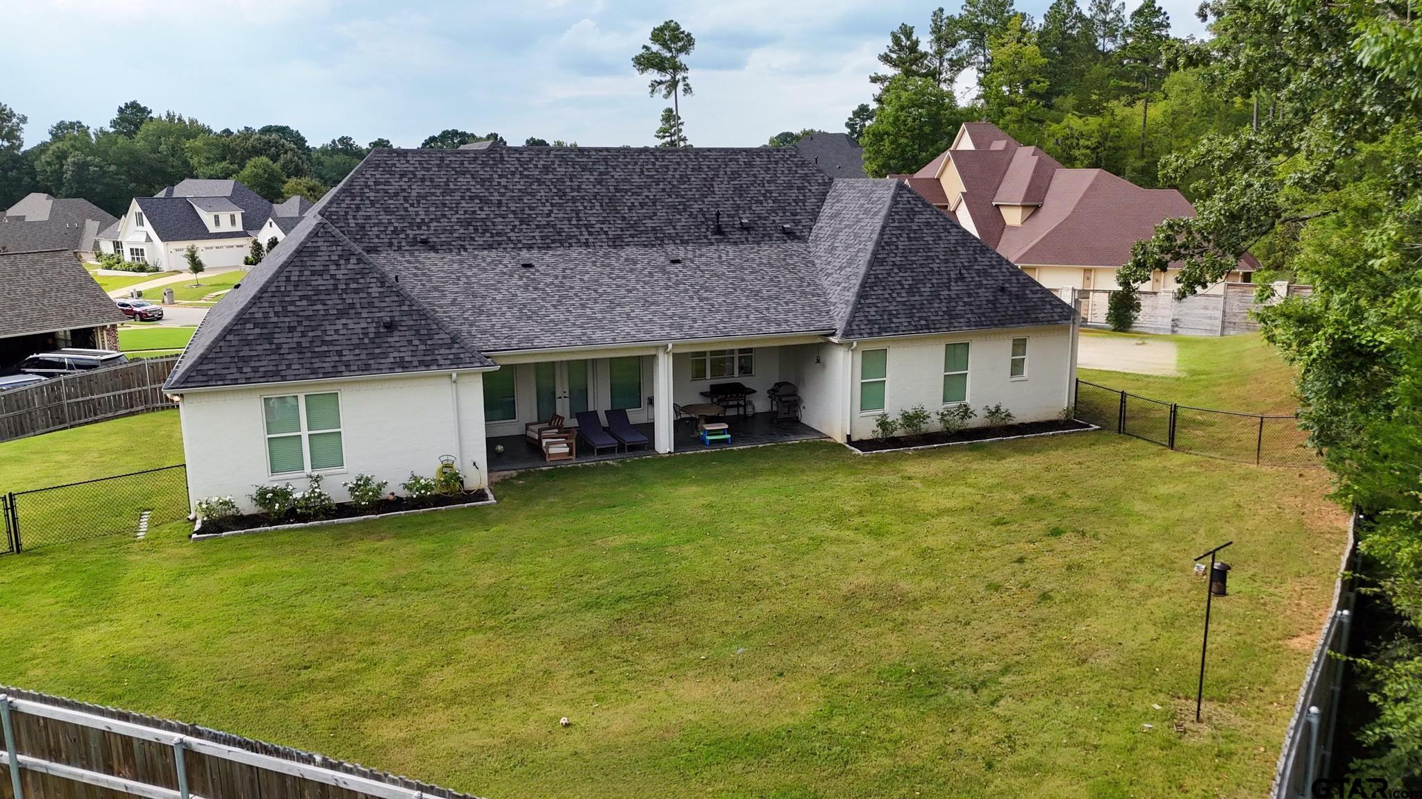 1242 Colt Lane Tyler, TX 75703 - Photo 37 of 47 a view of a house with a garden