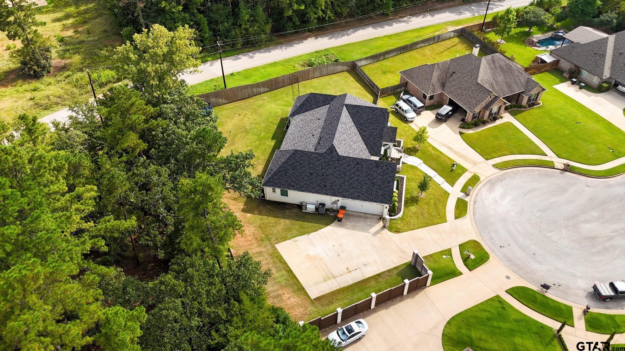 1242 Colt Lane Tyler, TX 75703 - Photo 39 of 47 an aerial view of a house with a swimming pool