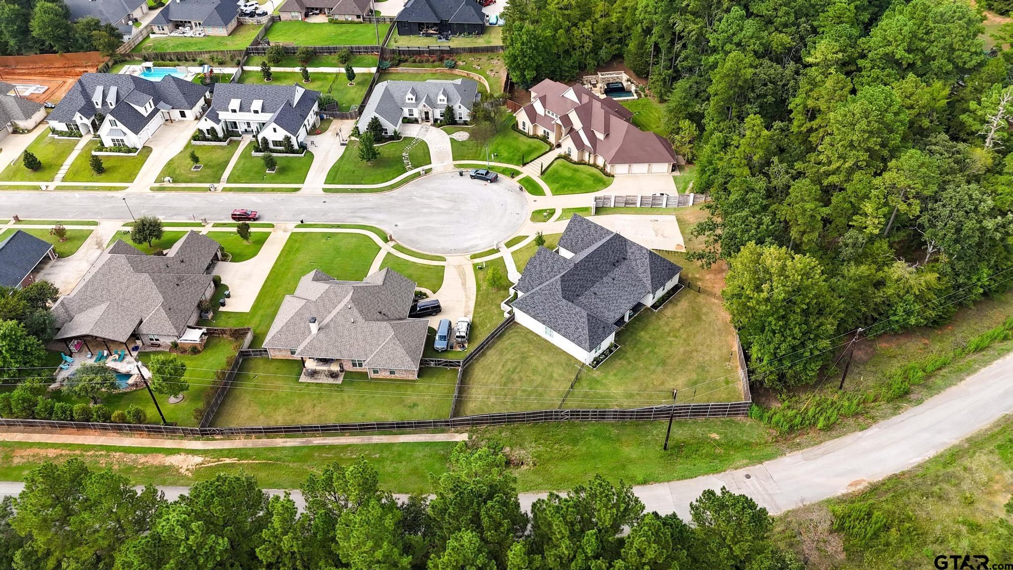 1242 Colt Lane Tyler, TX 75703 - Photo 40 of 47 an aerial view of a swimming pool with outdoor seating and yard