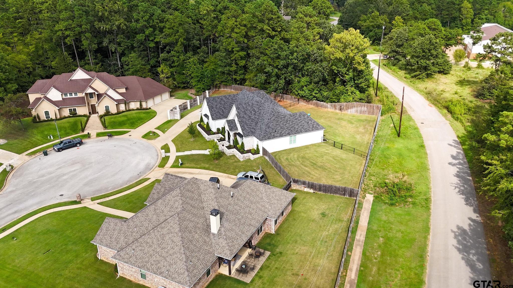 1242 Colt Lane Tyler, TX 75703 - Photo 43 of 47 an aerial view of residential house with outdoor space and swimming pool