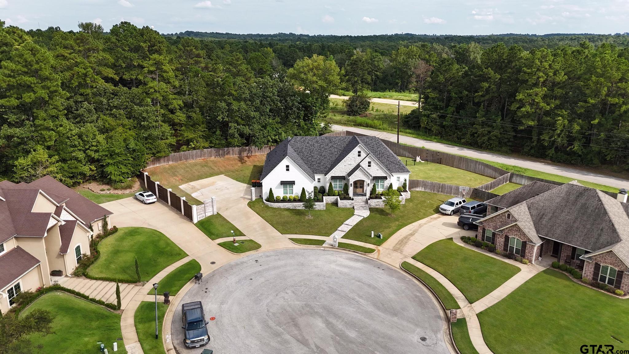1242 Colt Lane Tyler, TX 75703 - Photo 44 of 47 an aerial view of a house with swimming pool garden and patio