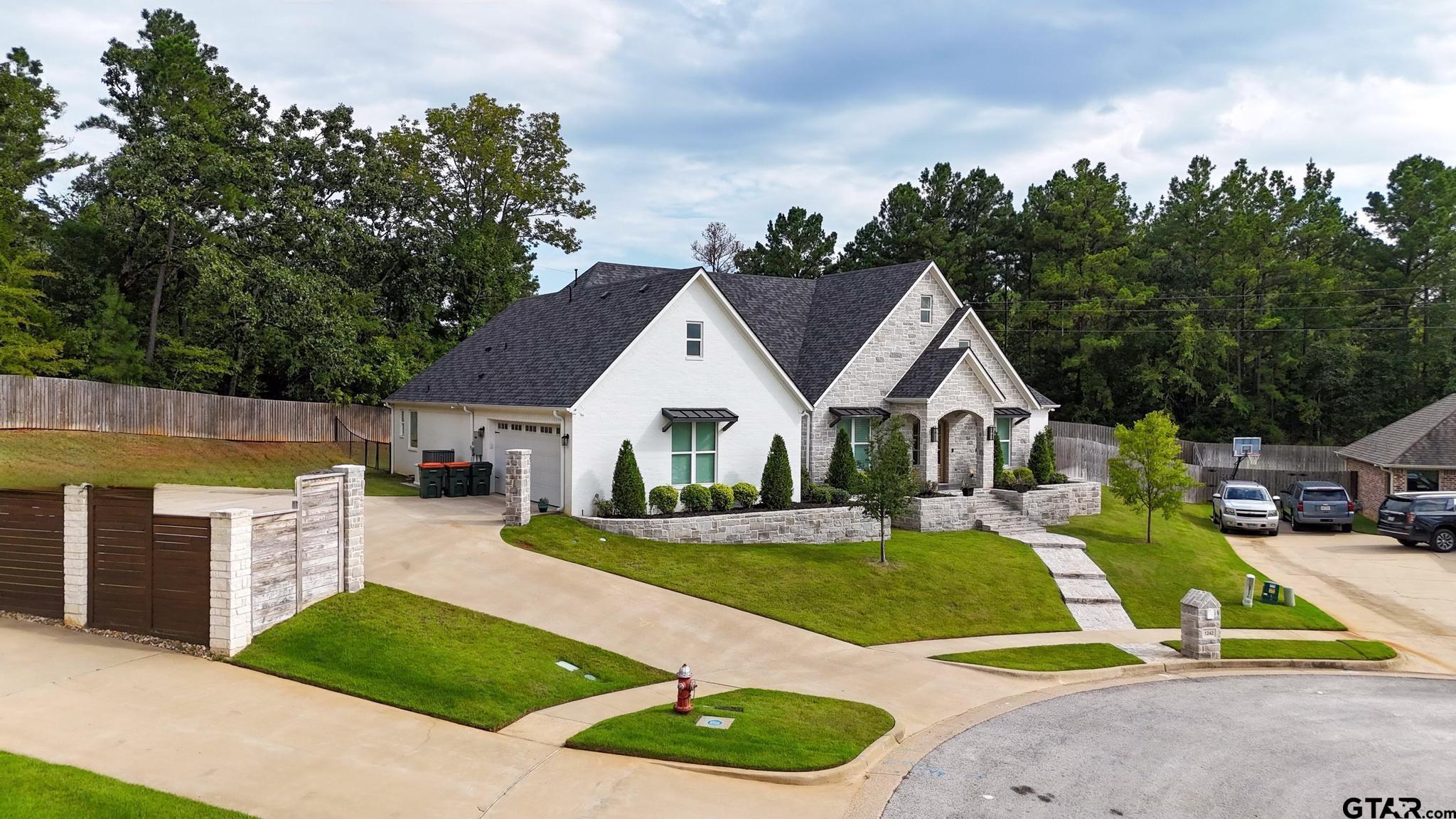 1242 Colt Lane Tyler, TX 75703 - Photo 46 of 47 a view of a house with a big yard and large trees
