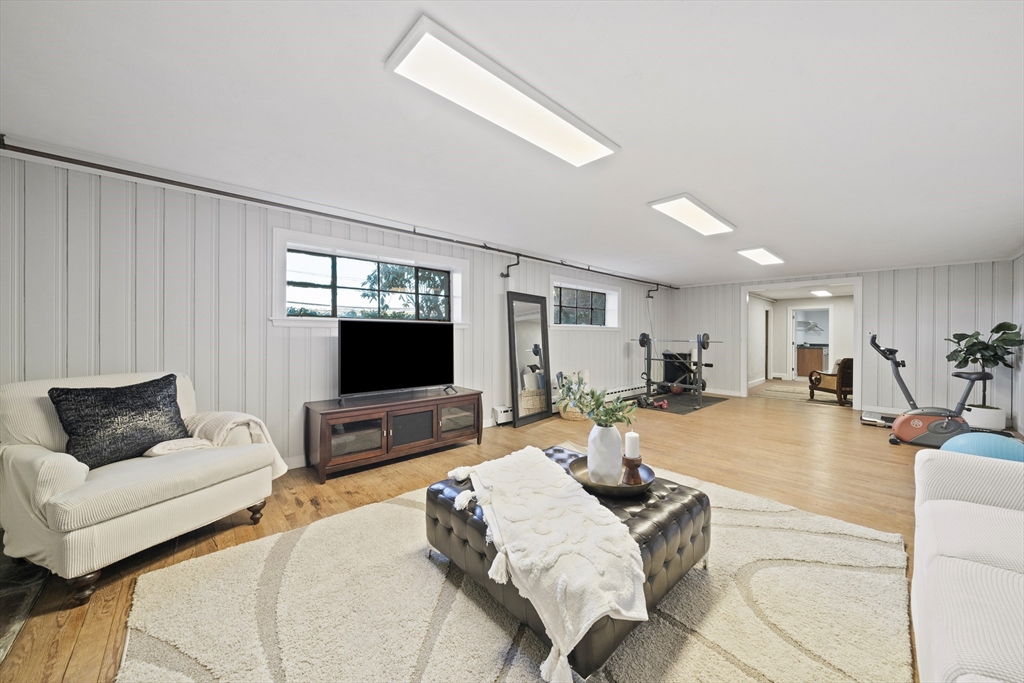447 Dudley Road Newton, MA 02459 - Photo 29 of 42 a living room with furniture and a flat screen tv