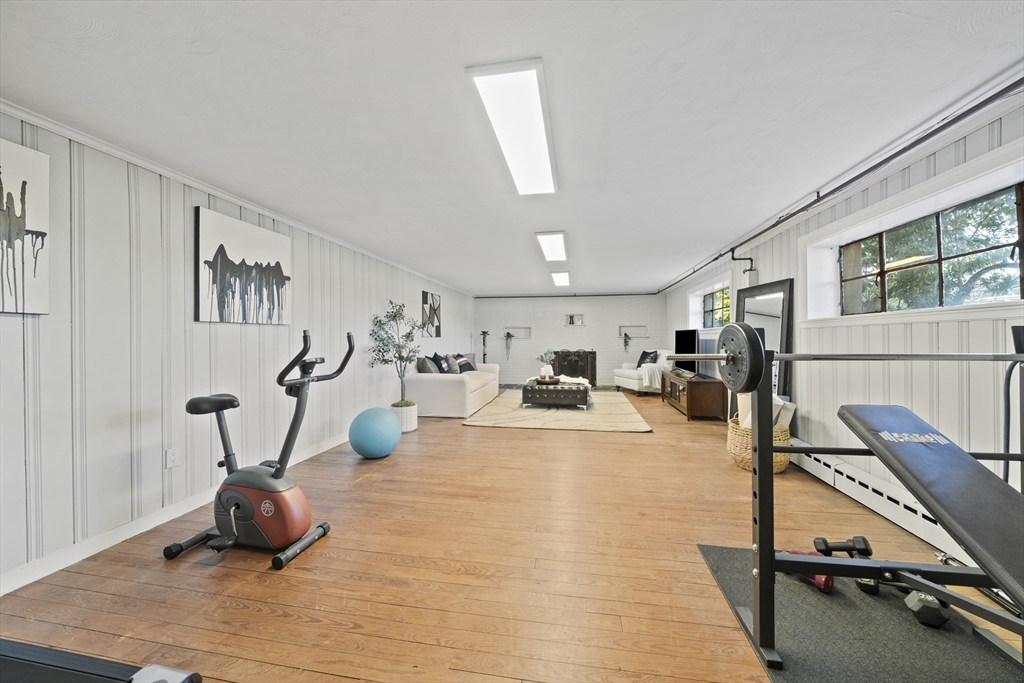 447 Dudley Road Newton, MA 02459 - Photo 32 of 42 a living room with furniture gym equipment and a view of living room