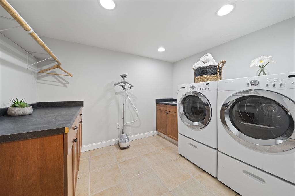 447 Dudley Road Newton, MA 02459 - Photo 33 of 42 a utility room with dryer and washer