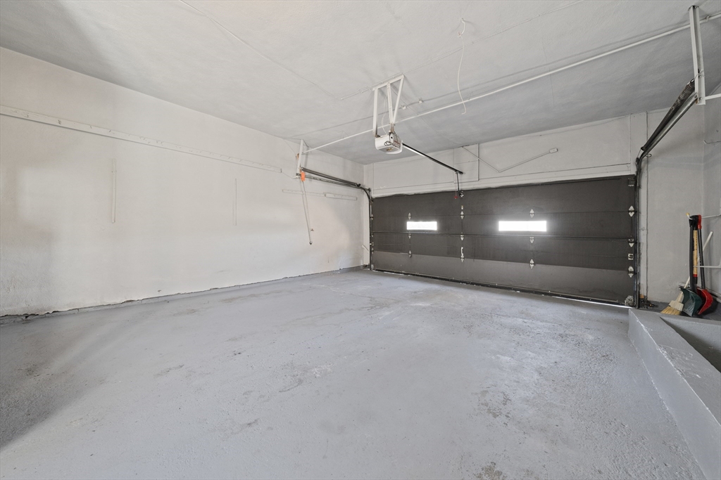 447 Dudley Road Newton, MA 02459 - Photo 37 of 42 an empty room with window and stairs