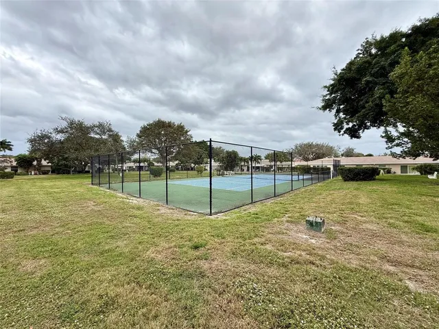 a view of a garden with basketball court