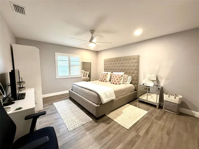 a bedroom with a bed and a couch