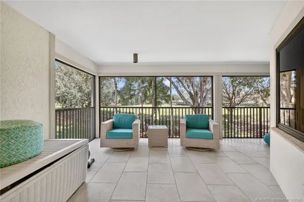 a view of a porch with a furniture