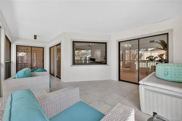 a living room with couch and a large window