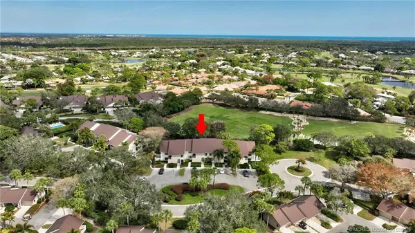 an aerial view of residential building and lake