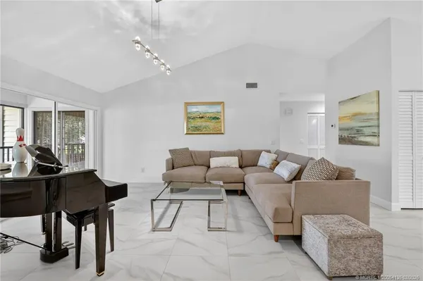 a living room with furniture rug and window
