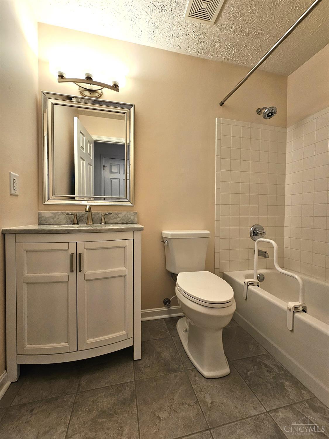 4331 Regency Ridge Court, Unit 306 Cincinnati, OH 45248 - Photo 31 of 45 Hall bath has newer tile floor, vanity, lighting, and comfort height toilet.