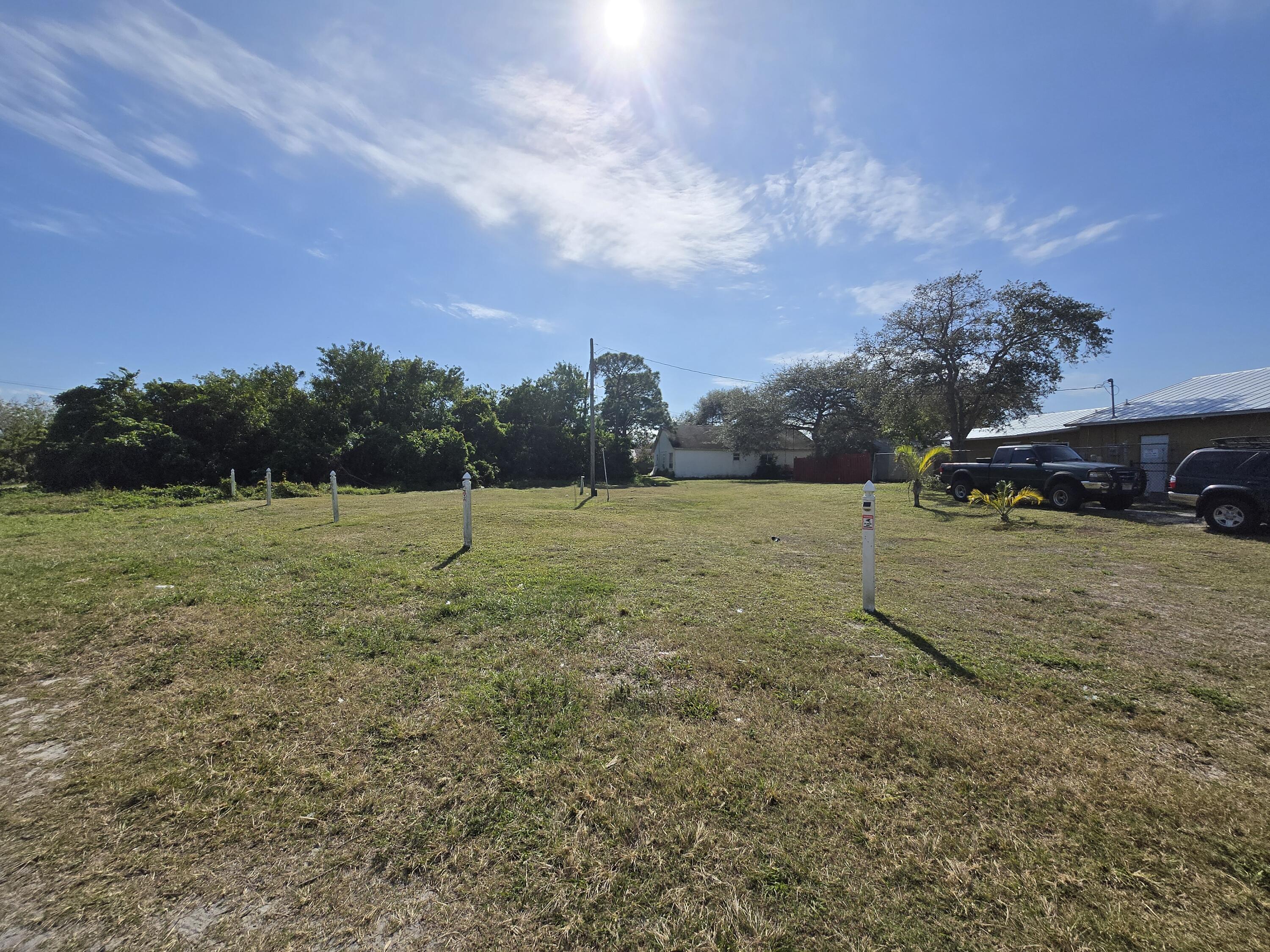 0 Southeast Primrose Way Stuart, FL 34997 - Photo 1 of 3 a view of a field with an trees
