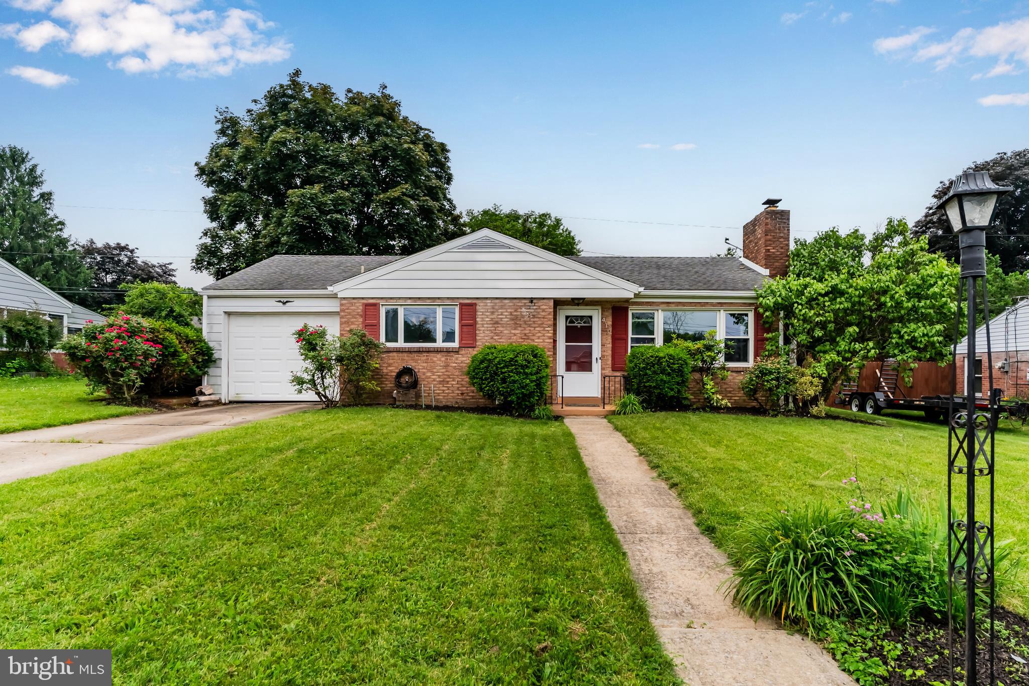 410 Belvedere Road Harrisburg, PA 17109 - Photo 1 of 29 a front view of a house with a yard