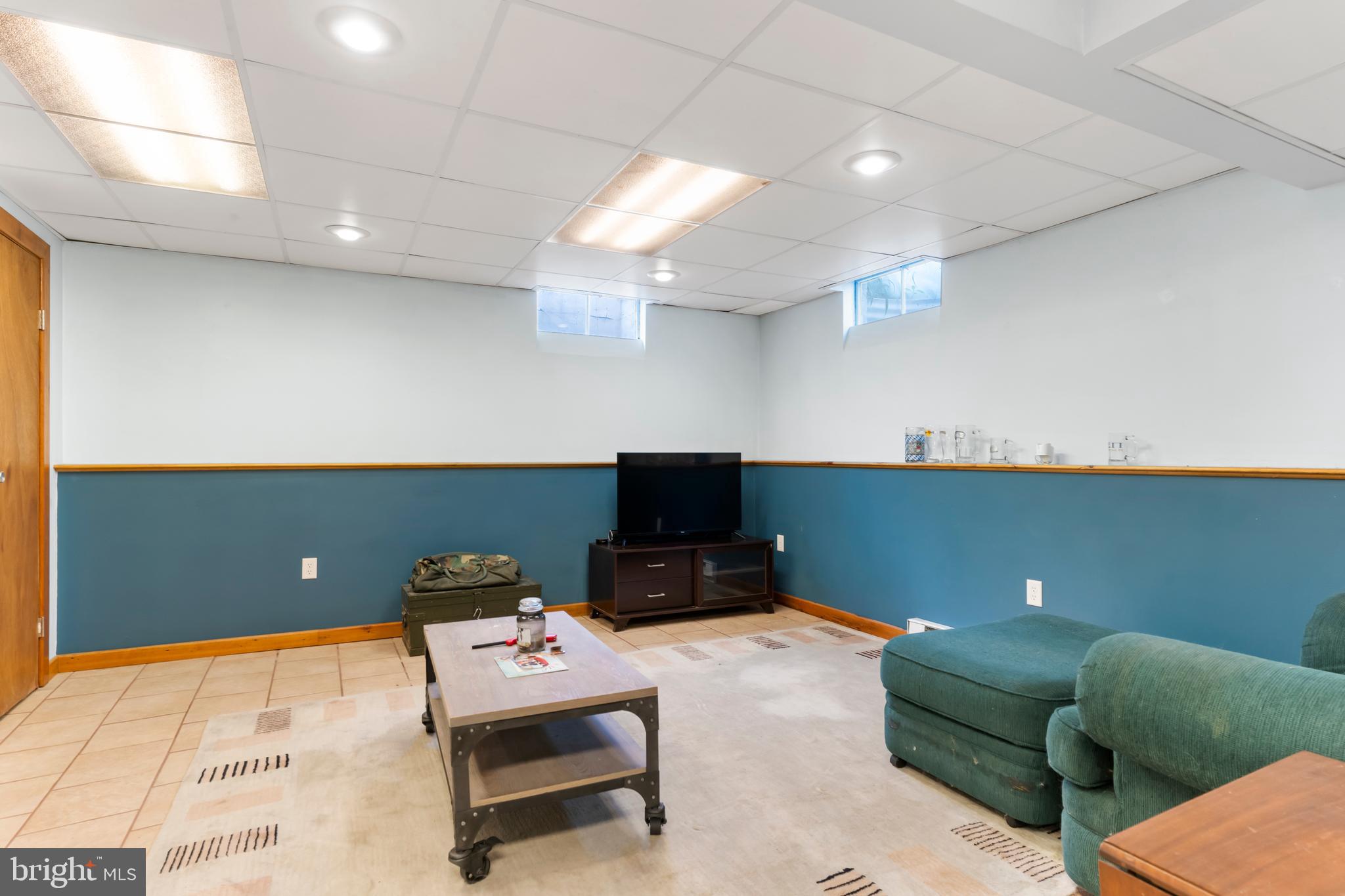 410 Belvedere Road Harrisburg, PA 17109 - Photo 22 of 29 a living room with furniture and a flat screen tv