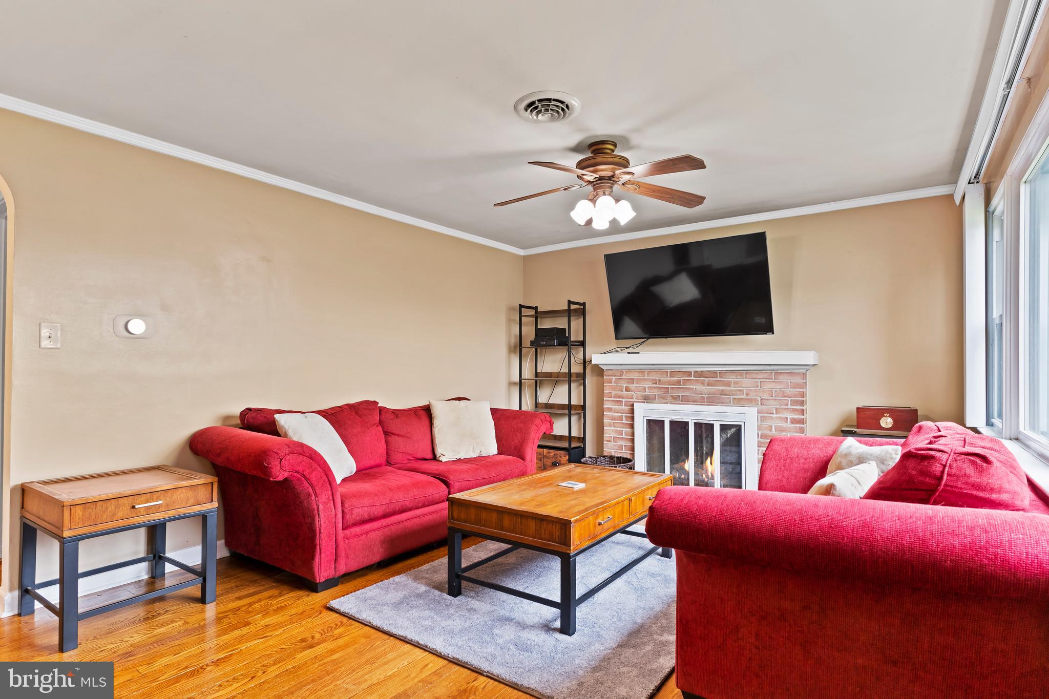 410 Belvedere Road Harrisburg, PA 17109 - Photo 6 of 29 a living room with furniture a flat screen tv and kitchen view