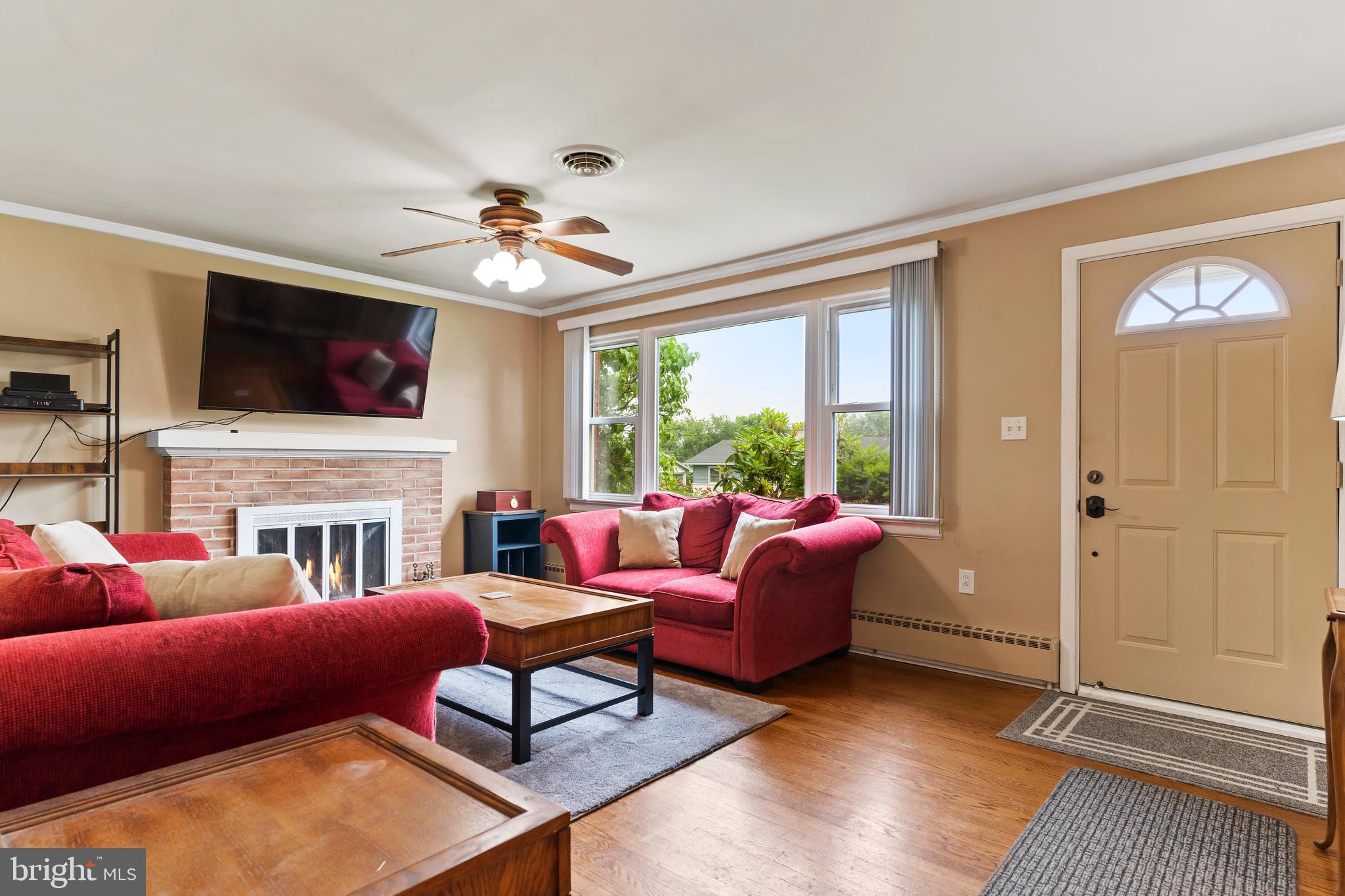 410 Belvedere Road Harrisburg, PA 17109 - Photo 7 of 29 a living room with fireplace furniture and a flat screen tv