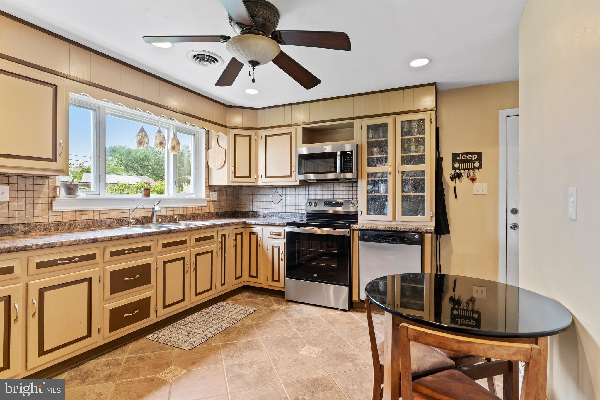 410 Belvedere Road Harrisburg, PA 17109 - Photo 10 of 29 a kitchen with stainless steel appliances granite countertop a stove and a sink
