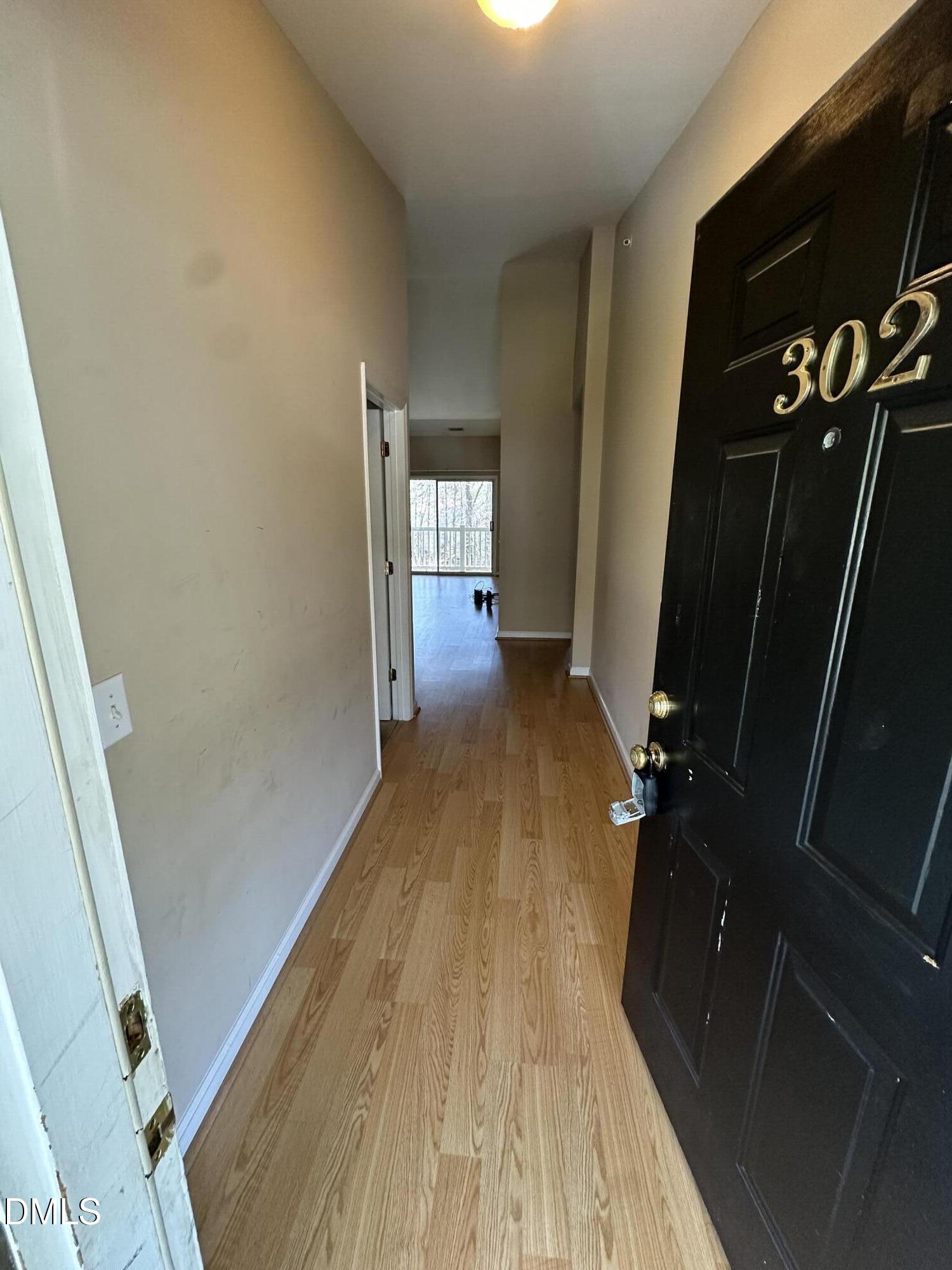 1901 Trailwood Heights Lane, Unit 302 Raleigh, NC 27603 - Photo 1 of 16 a view of a living room with furniture