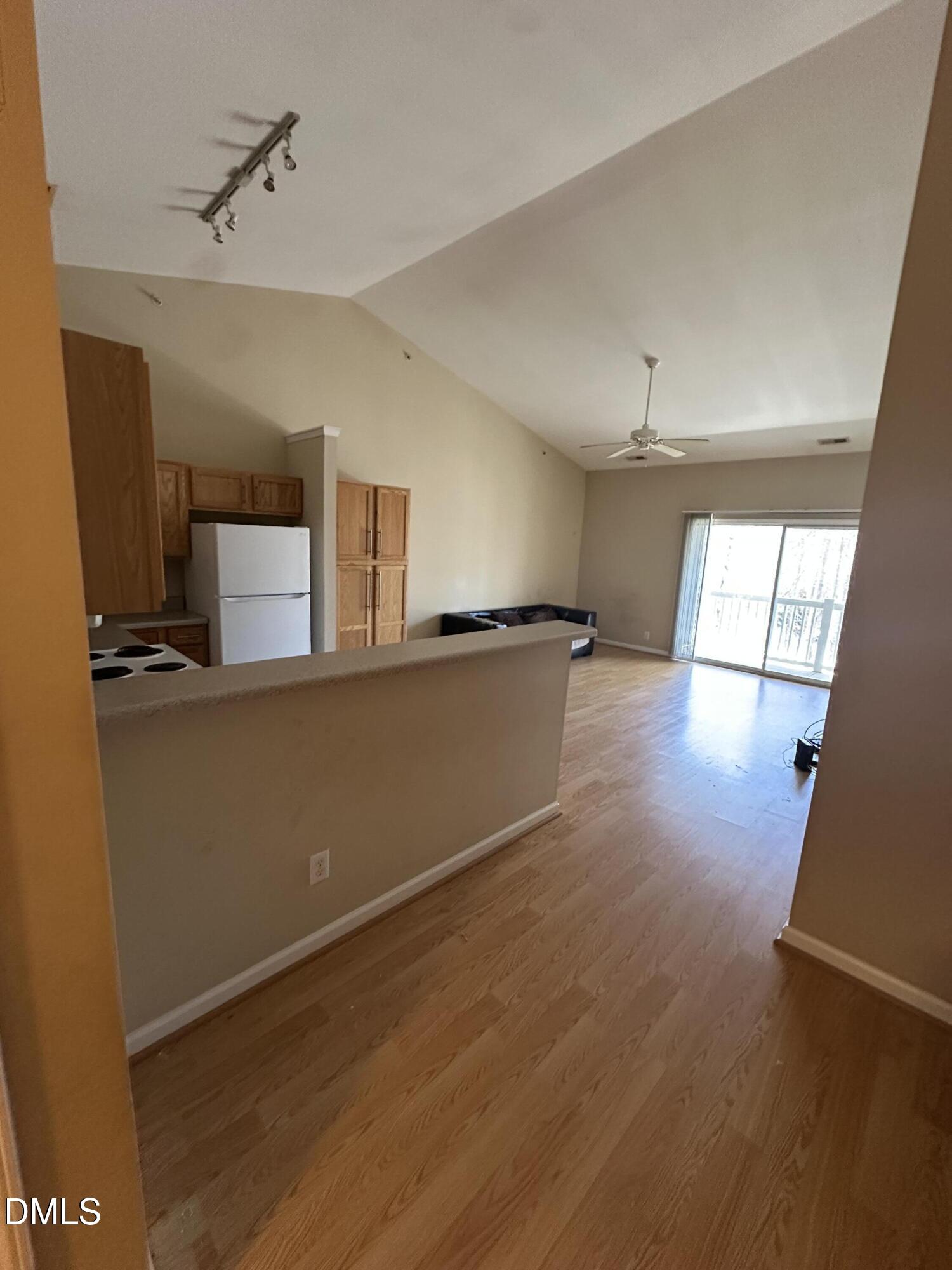 1901 Trailwood Heights Lane, Unit 302 Raleigh, NC 27603 - Photo 3 of 16 a view of a kitchen with an empty space and a window
