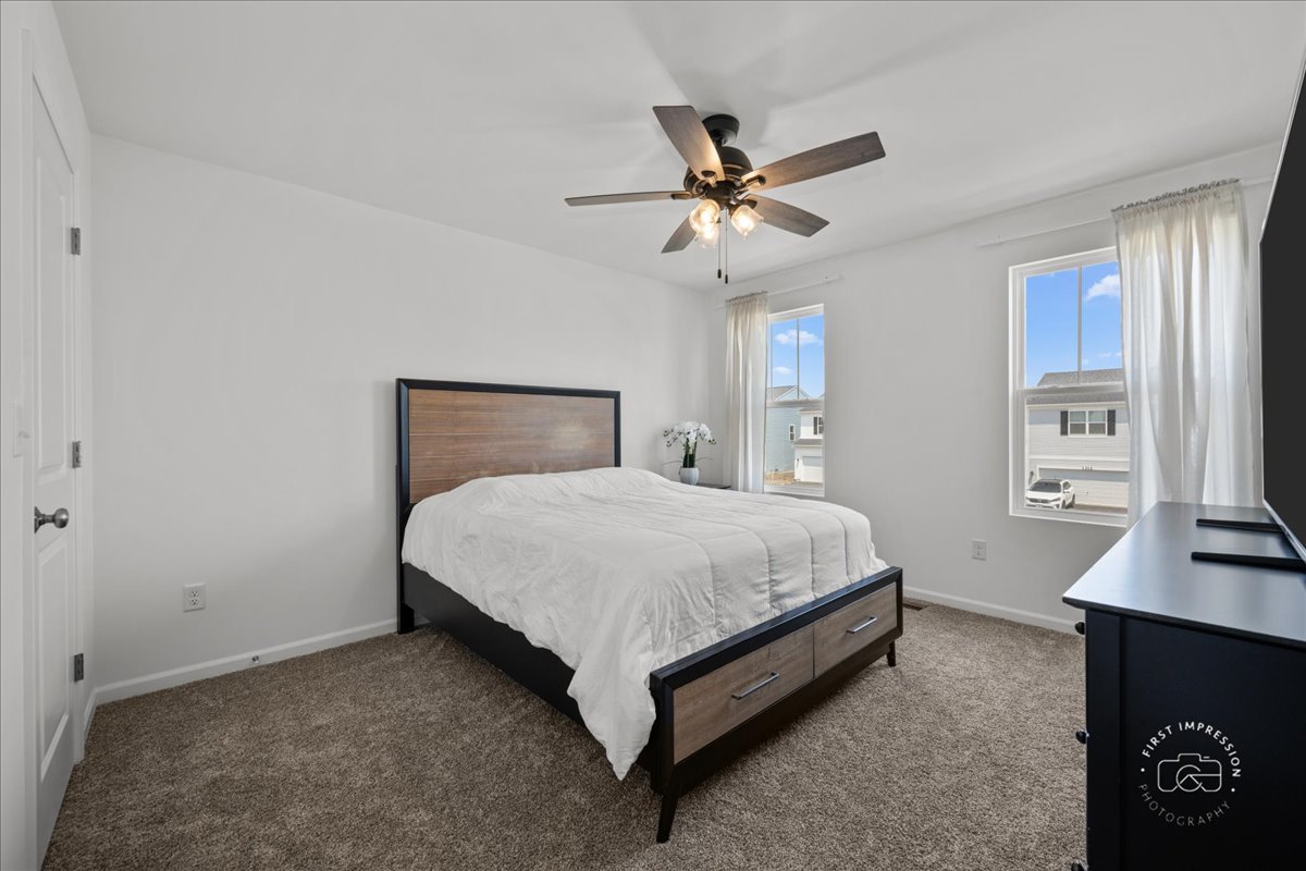 1313 Endicott Road South Elgin, IL 60177 - Photo 15 of 20 a bedroom with a bed and a window