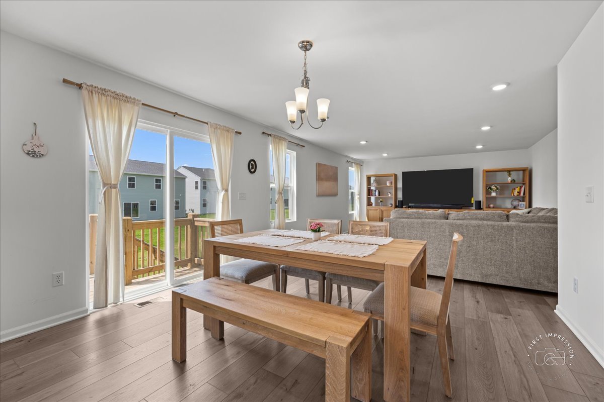 1313 Endicott Road South Elgin, IL 60177 - Photo 7 of 20 a view of a dining room with furniture window and wooden floor