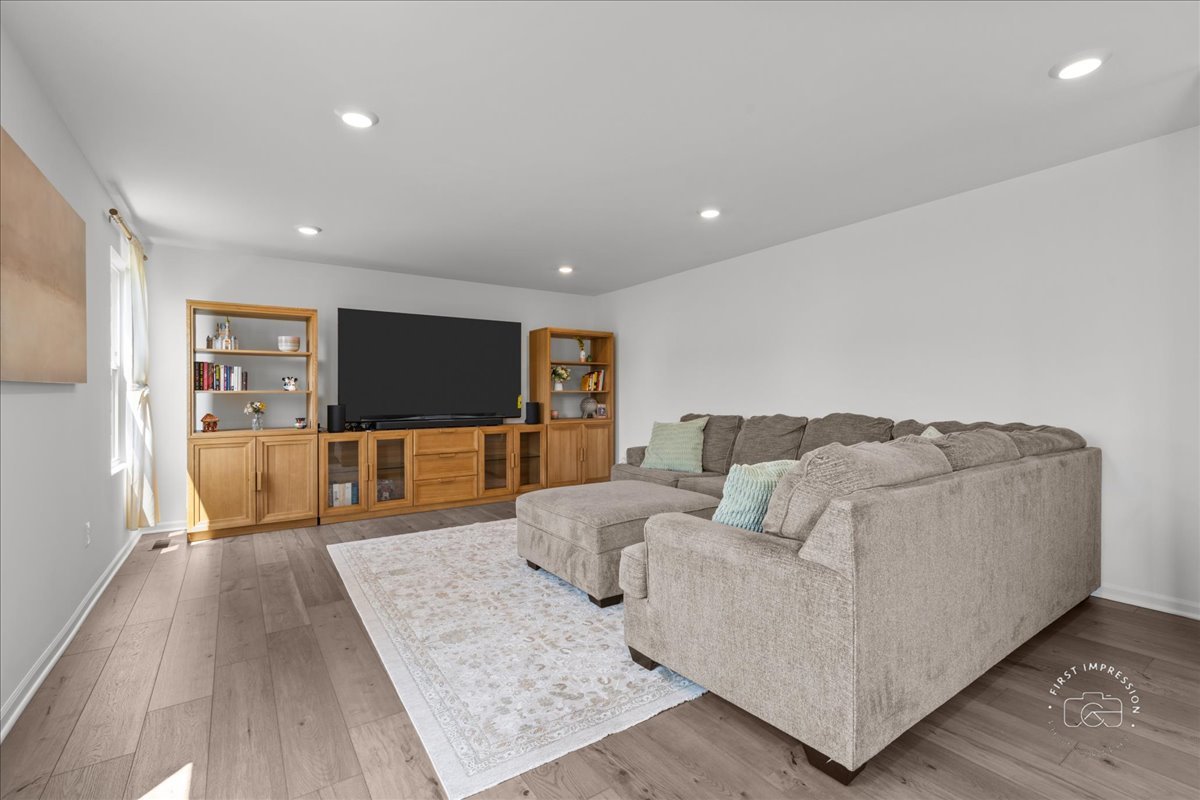 1313 Endicott Road South Elgin, IL 60177 - Photo 9 of 20 a living room with furniture and a flat screen tv