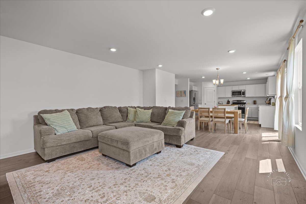 1313 Endicott Road South Elgin, IL 60177 - Photo 10 of 20 a living room with furniture and kitchen view