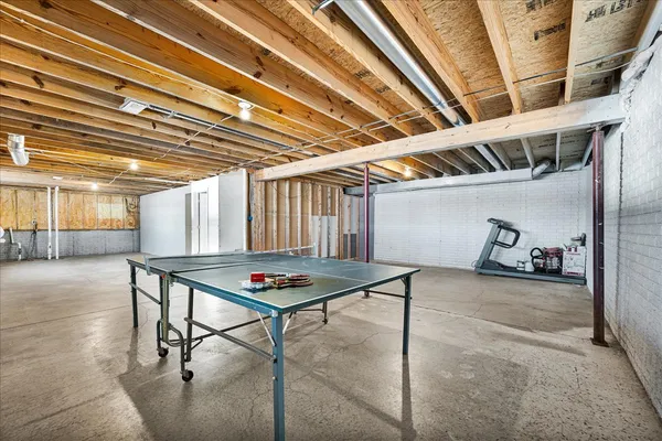 a view of an empty room with a ceiling fan