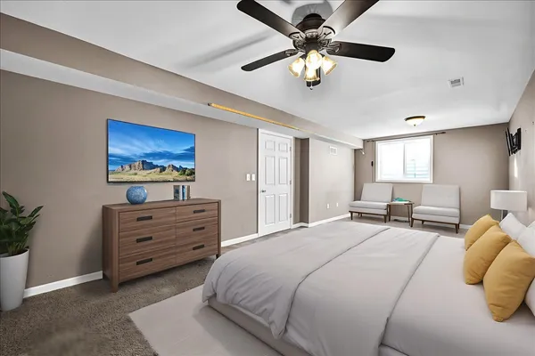 a view of a yard in front of a house with a large tree