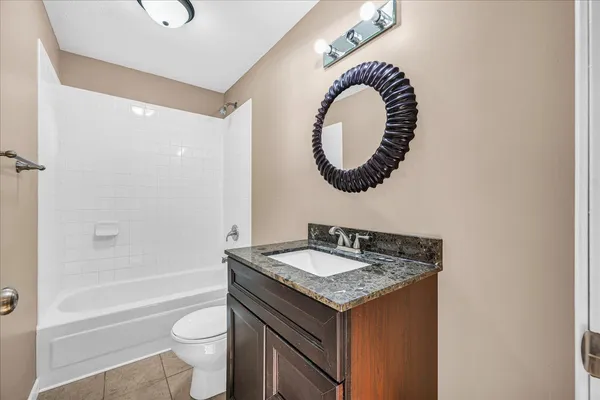 a house view with swimming pool in front of the house