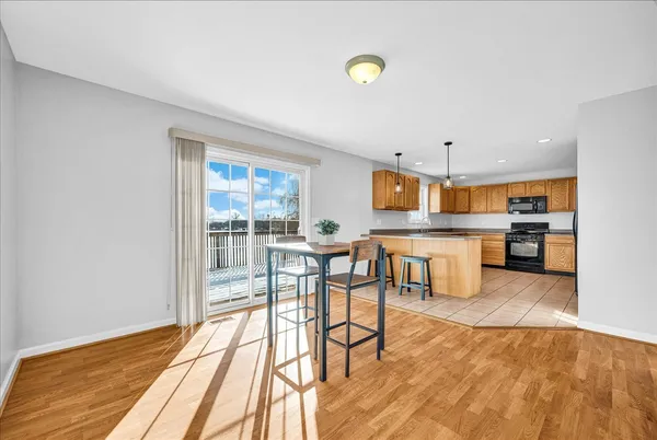 a kitchen with stainless steel appliances granite countertop a refrigerator a stove a sink and dishwasher