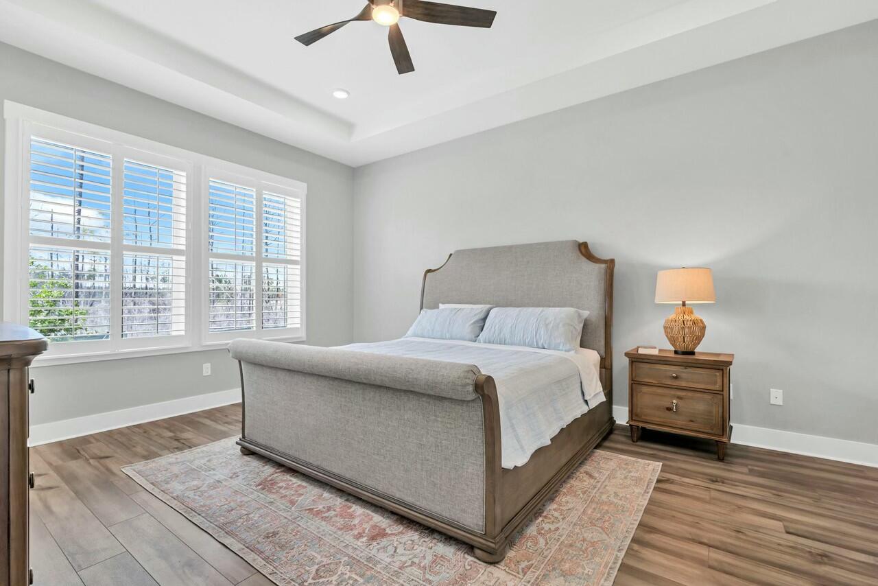 117 River Rise Way Watersound, FL 32461 - Photo 4 of 14 a bed room with a bed and a chandelier