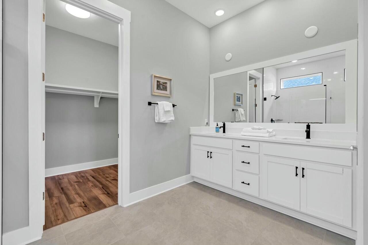 117 River Rise Way Watersound, FL 32461 - Photo 5 of 14 a bathroom with double sink and a mirror