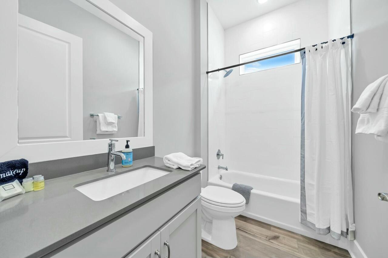 117 River Rise Way Watersound, FL 32461 - Photo 8 of 14 a bathroom with a sink a toilet and shower