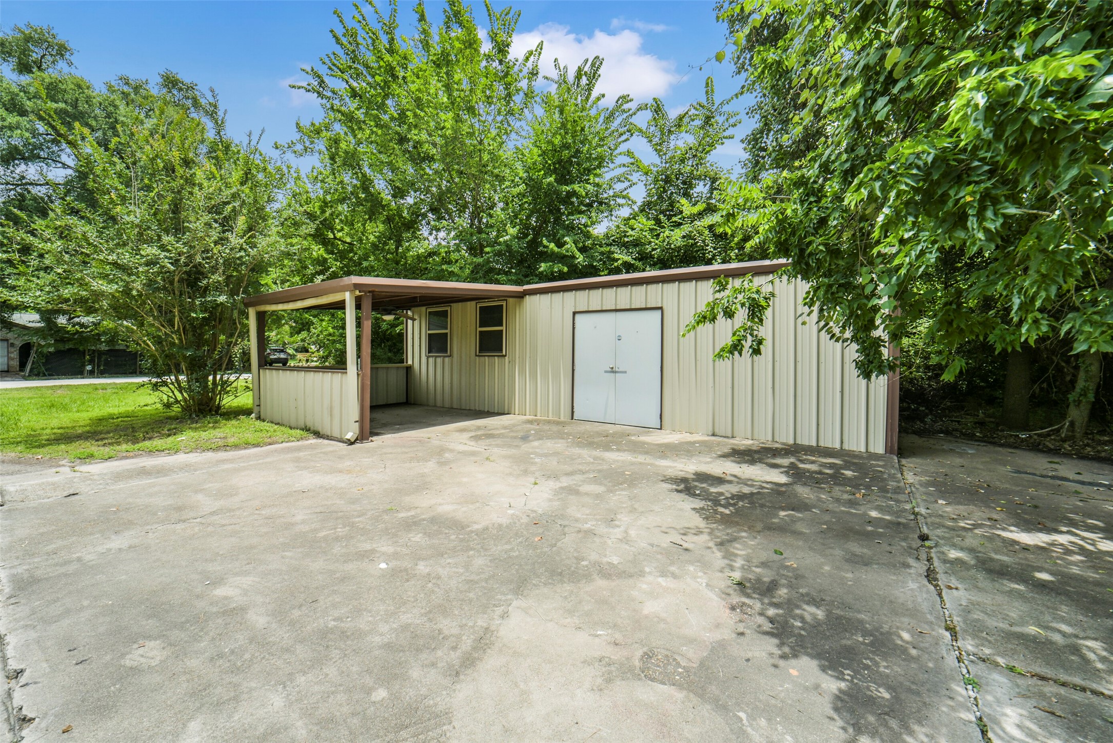 11023 Forrest Valley Drive Houston, TX 77065 - Photo 40 of 47 a front view of a house with a yard and garage