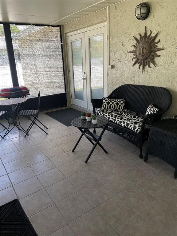 575 Tiberon Cove Road Longwood, FL 32750 - Photo 42 of 56 a living room with a couch and a table