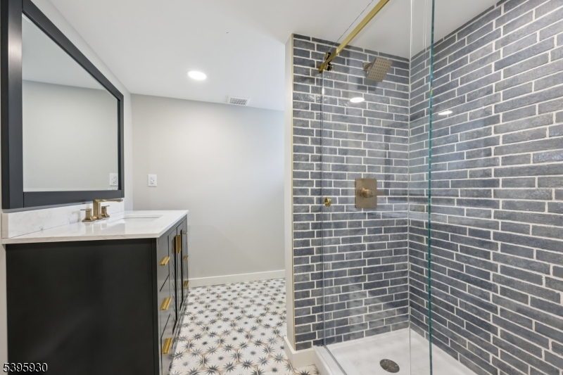 12 Rocky Point Road West Milford, NJ 07421 - Photo 20 of 50 a bathroom with a sink a toilet and mirror