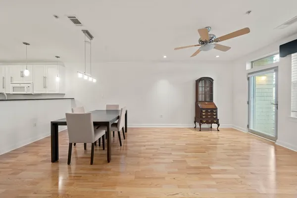 a view of a kitchen and dining room