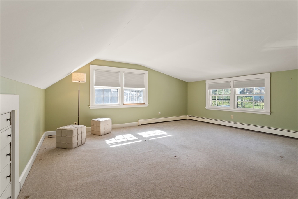 29 Kenwin Road Winchester, MA 01890 - Photo 27 of 35 a view of an empty room with a window and a kitchen