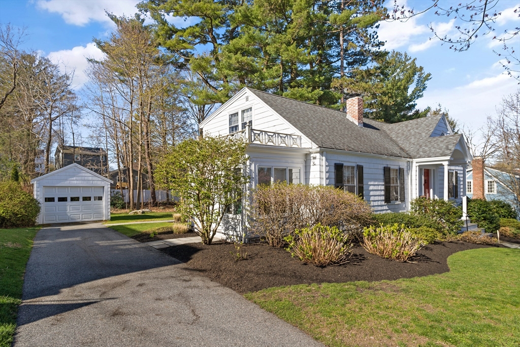 29 Kenwin Road Winchester, MA 01890 - Photo 5 of 35 a front view of a house with a yard and trees