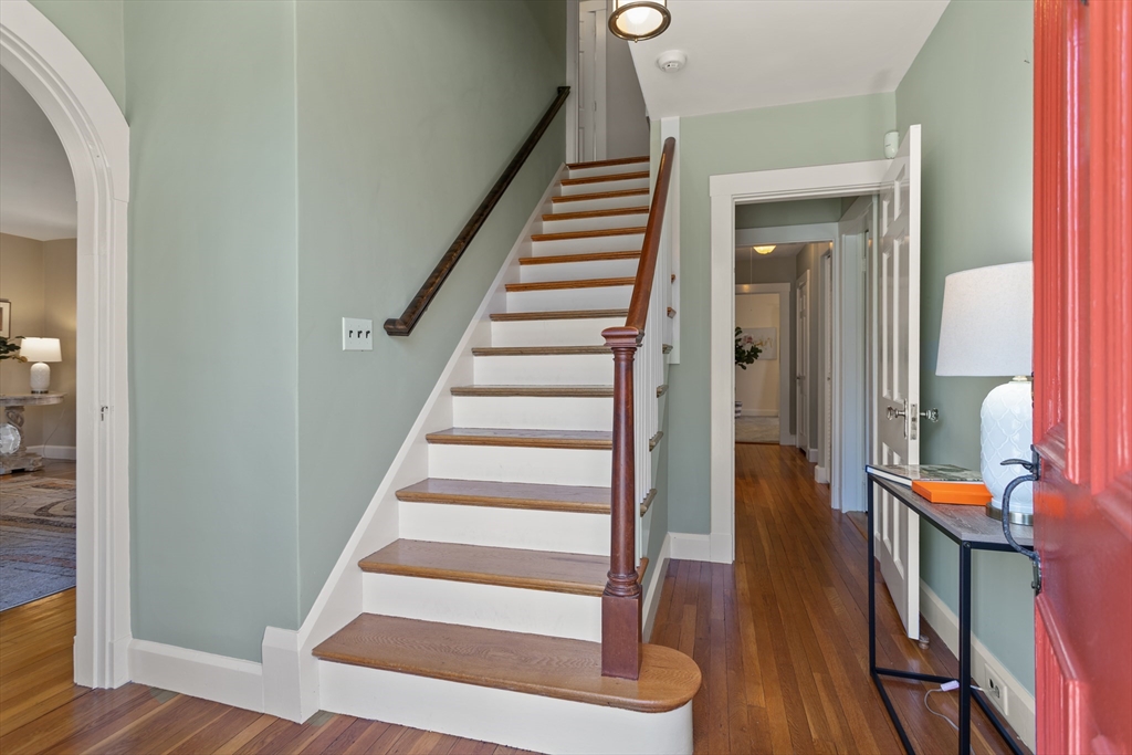 29 Kenwin Road Winchester, MA 01890 - Photo 8 of 35 a view of a hallway with wooden floor and windows