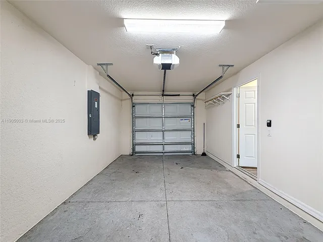 a view of a big room with furniture and a ceiling fan