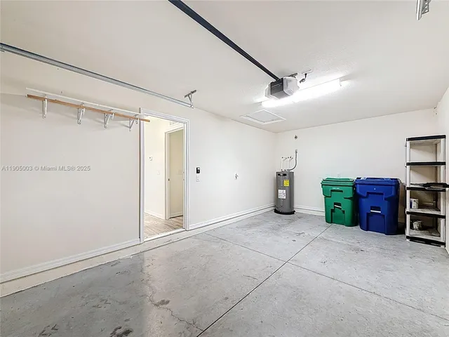 a view of a field with trees in the background