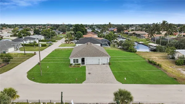 a view of a swimming pool with a yard