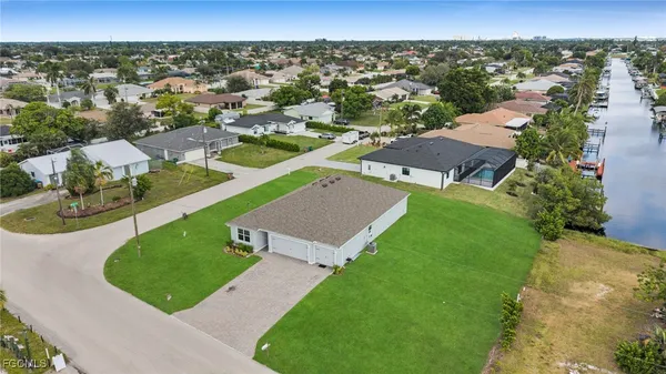 an aerial view of a house with a garden