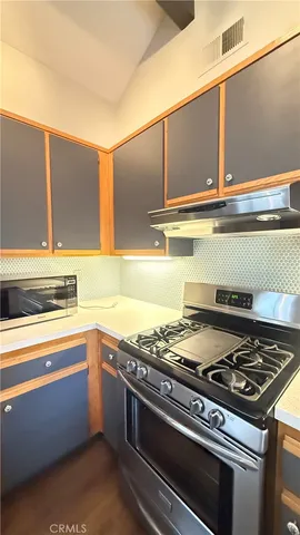 a kitchen with stainless steel appliances and a stove