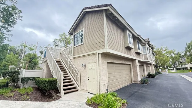 a view of entryway with wooden floor and stairs