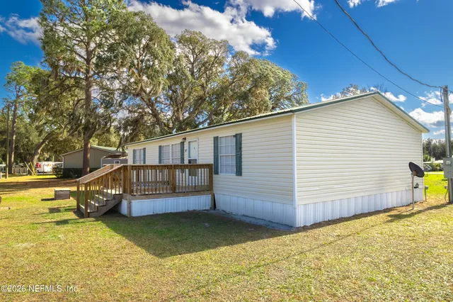 a view of a livingroom with furniture and chandelier
